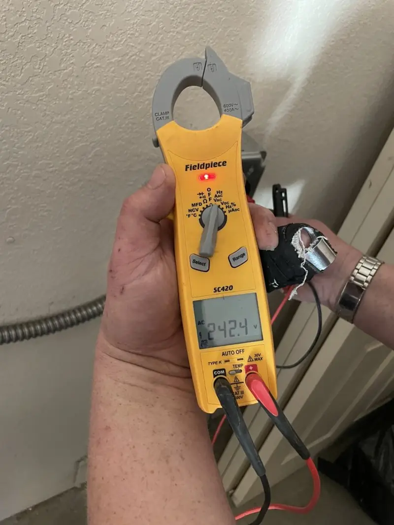 Voltage testing with clamp meter during Ceiling Fan Installation in Dumont
